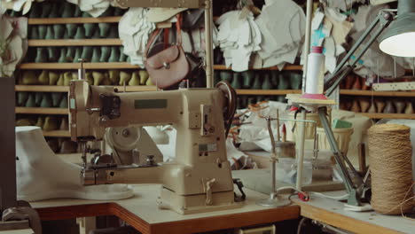 Shoemaker-Workplace-with-Sewing-Machine-in-Workshop